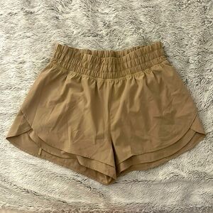 Tan high-rise athletic shorts